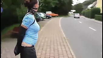 Millie Fenton În Public Cu Ballgag Și Armbinder