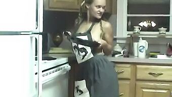 A Sexually Promiscuous Woman Uses Kitchen Tools To Stimulate Herself On A Countertop, While Wearing An Apron