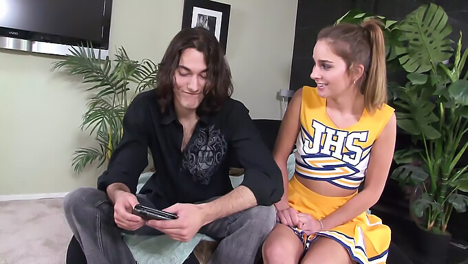 A handsome man with a large penis ejaculates in the mouth of an attractive cheerleader following intercourse